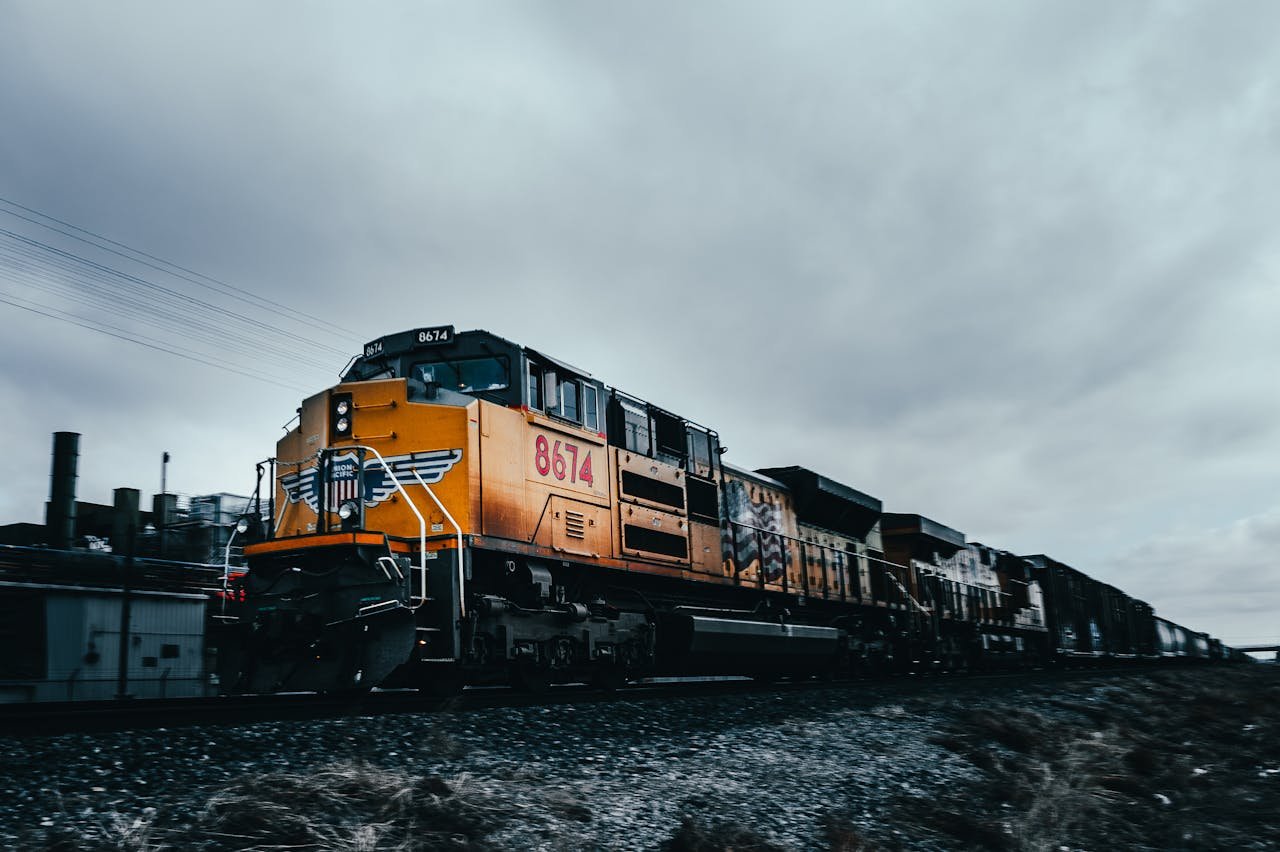 Train driving along railroad